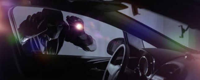 Thief Looking in Car Window