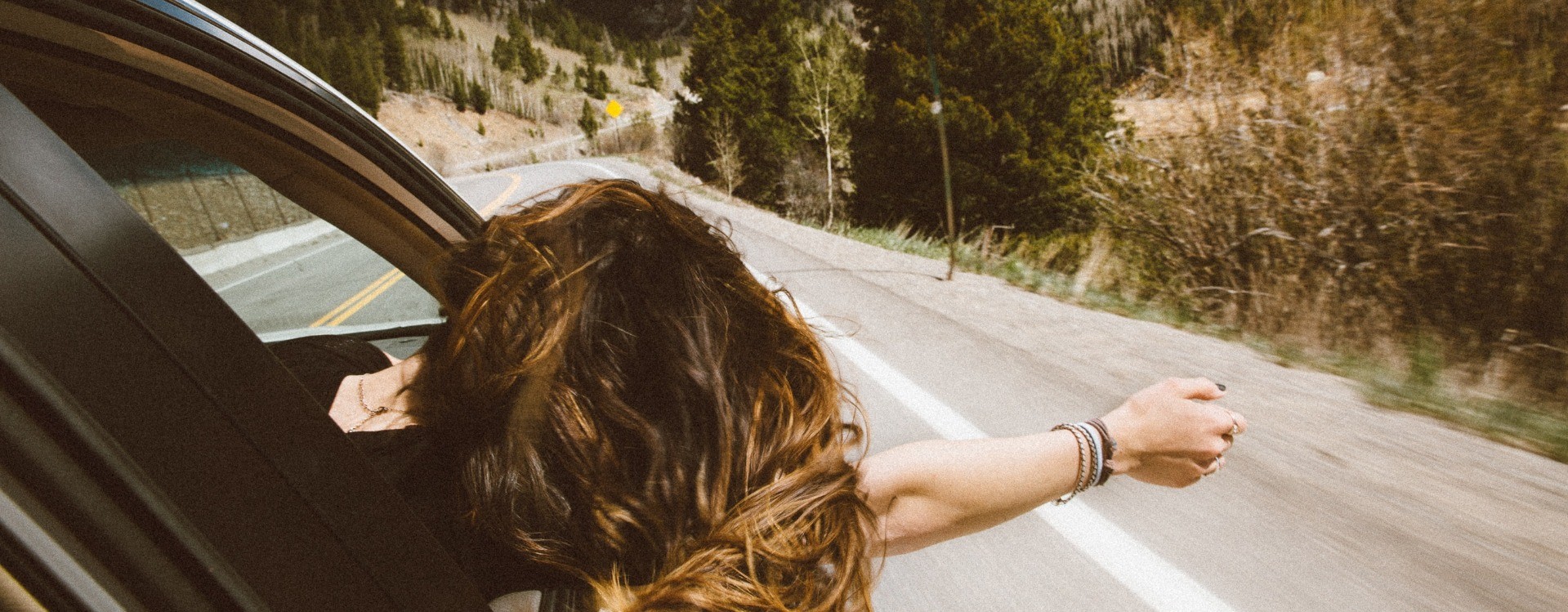 Woman Enjoying Car Ride
